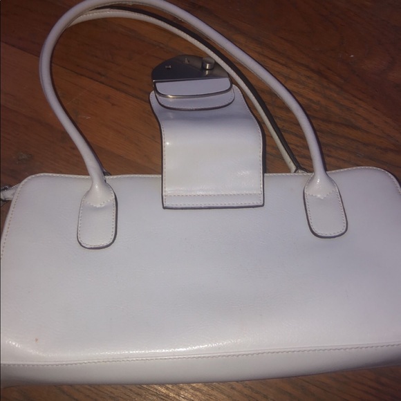 a white handbag with a brown inside - Picture 2 of 2